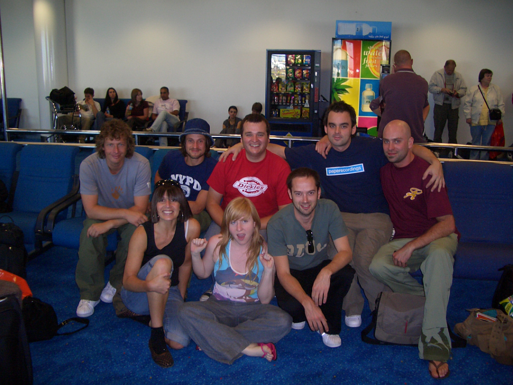 Photograph of the full band: Mark 'Mav' Woodley, Danielle Moore, Matt Klose, Holly?, James Baron, Tim Davies, Chris Todd, Tom Bailey